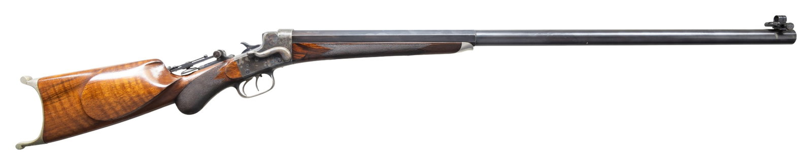 REMINGTON-HEPBURN NO. 3 QUALITY "B" MATCH SINGLE: SHOT RIFLE. CAL. 38-50 (marked on bottom bbl. flat). S#. 7977. Bbl. 32" octagon to round measuring 1" at the muzzle. Vernier tang sight with a wind gauge spirit level front sight. Case colored side