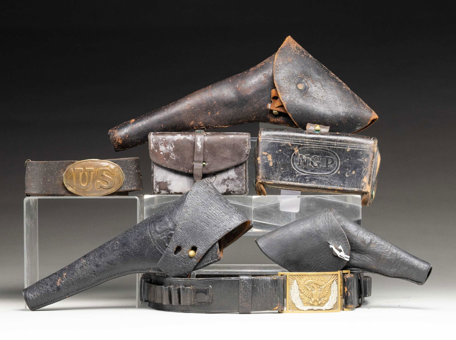 GROUP OF 7 CIVIL WAR & INDIAN WAR ERA LEATHER: ACCOUTREMENTS. Civil War US oval enlisted belt & buckle; Civil War Colt army flap holster, break in tab, sewn edge loose; Indian War embossed US in oval S&W Schofield Army flap holster; small