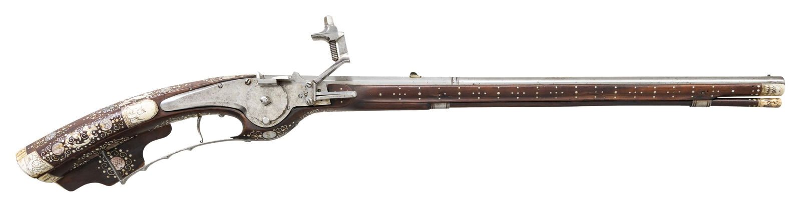 NICELY DECORATED WHEELLOCK PETRONEL.: Cal. 60. S# NSN. Essentially a pistol/carbine the petronel was meant to be used while on horseback and fired with the short butt resting on one's chest. This example has 21" half round half octagon