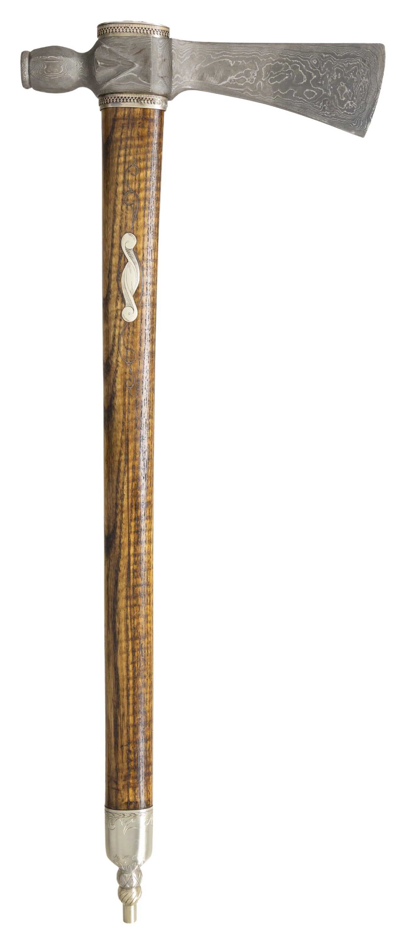 CONTEMPORARY DAMASCUS STEEL PIPE TOMAHAWK.: 8.75" forged Damascus head, 2.25" cutting edge, German silver mounted 22" wood stem. CONDITION: fine overall. (02-25229/JS). NON-GUN. $800-1,200.