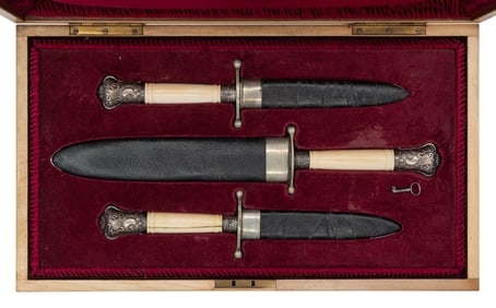 CASED SET OF THREE REPRODUCTION BOWIE KNIVES.