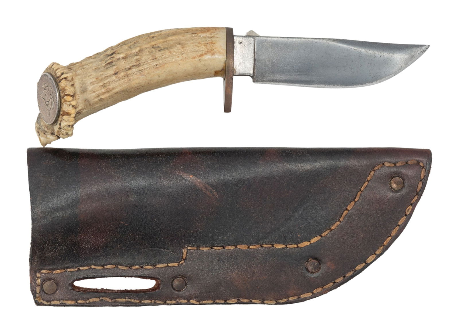 CUSTOM HUNTING KNIFE.: 9.5" overall, 5" clip point blade, heavy copper lozenge shaped guard, shaped crown stag handle, Kennedy half dollar pommel cap. Slotted brown Plains-style leather sheath. CONDITION: very good