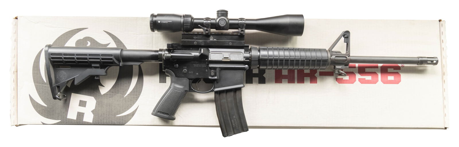 RUGER MODEL AR-556 SCOPED SEMI-AUTO CARBINE.: Cal. 5.56 Nato. S# 855-22961. Bbl. 16.1" cold hammer forged having 1 in 8" twist rate; Ruger flash hider and F-height milled front sight with integral bayonet lug, push button sling swivel plus post s