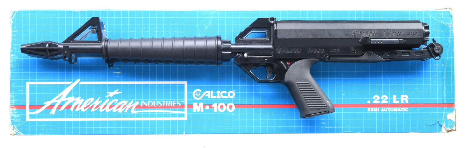 DESIRABLE PRE-BAN AMERICAN INDUSTRIES CALICO M-100: SEMI AUTO RIFLE WITH MATCHING FACTORY BOX. Cal. 22 LR. S# A002361. Mfg. 1986-1994 in Bakersfield, CA. Chrome-Moly 16.1" bbl. w/ protective shroud that includes muzzle brake, protected post front sight