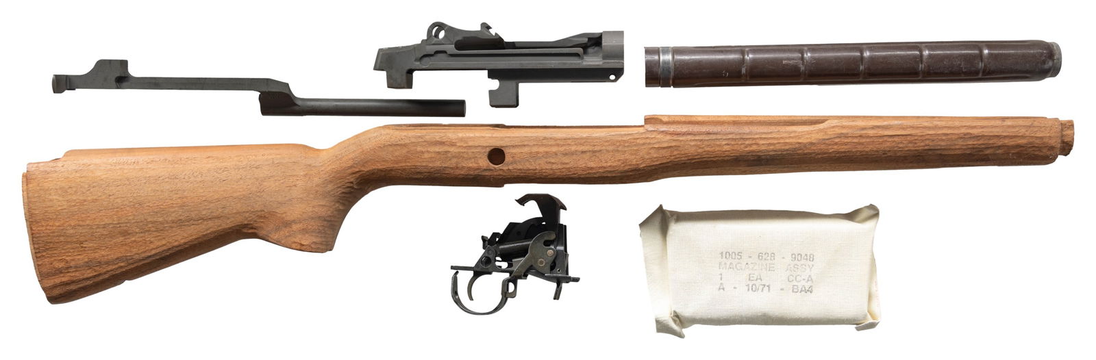 UNASSEMBLED SMITH ENTERPRISES M21 RECEIVER WITH: STOCK, & PARTS. Cal. 7.62mm. S# 002180. An unassembled Smith Enterprises M-21 receiver. Gray parkerized finish. Lettering has been filled in white for ease of reading. Unfinished, hardwood shoulder st