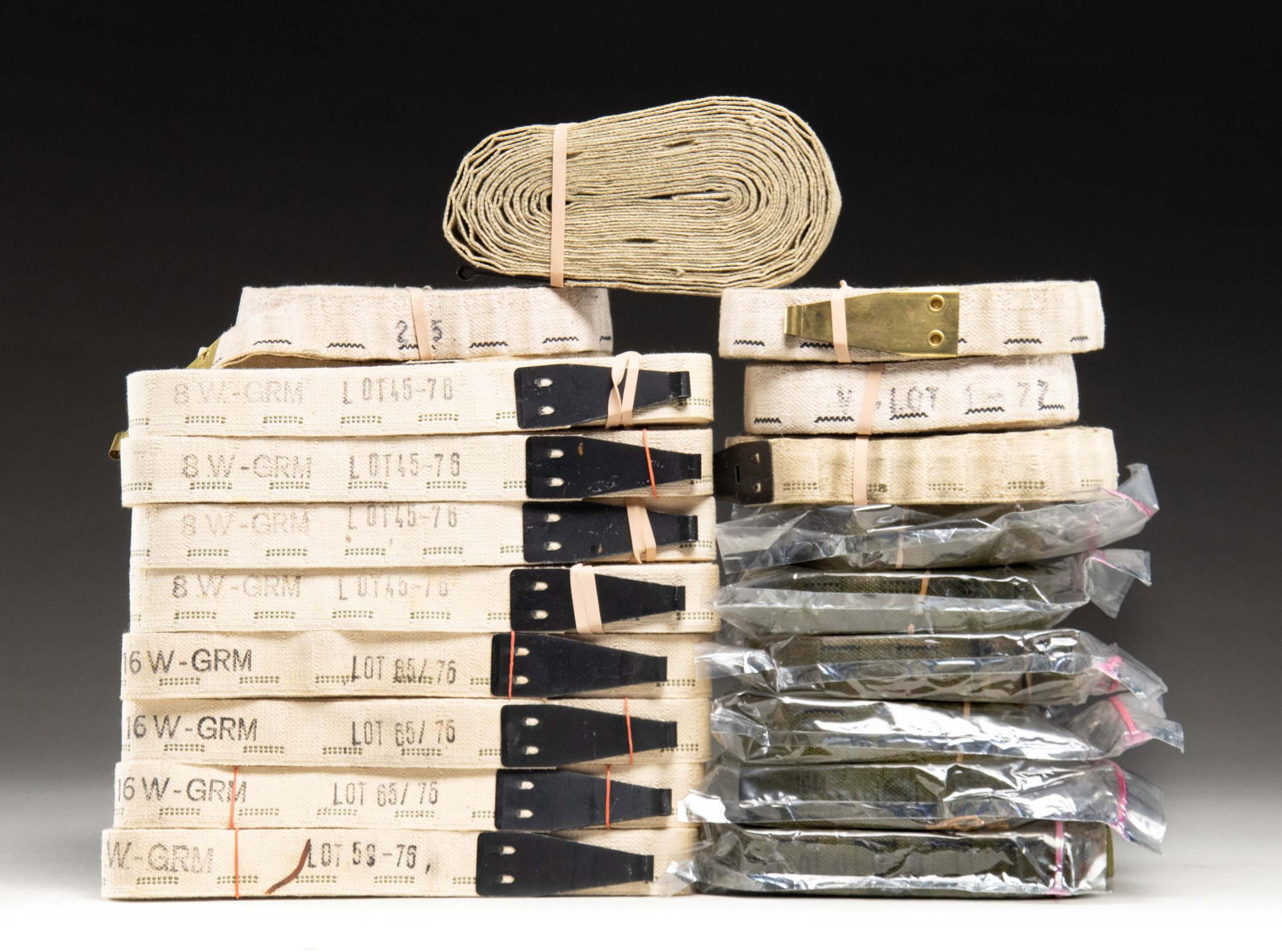 LOT OF 20 BROWNING 1917/1919 CLOTH MACHINE GUN: BELTS. Lot of 20 Browning 1917/1919 machine gun belts, including: 1) x6 surplus white cloth belts (assorted lengths). x6 OD cloth belts (assorted lengths), as well as x8 (apparent reproduction) white