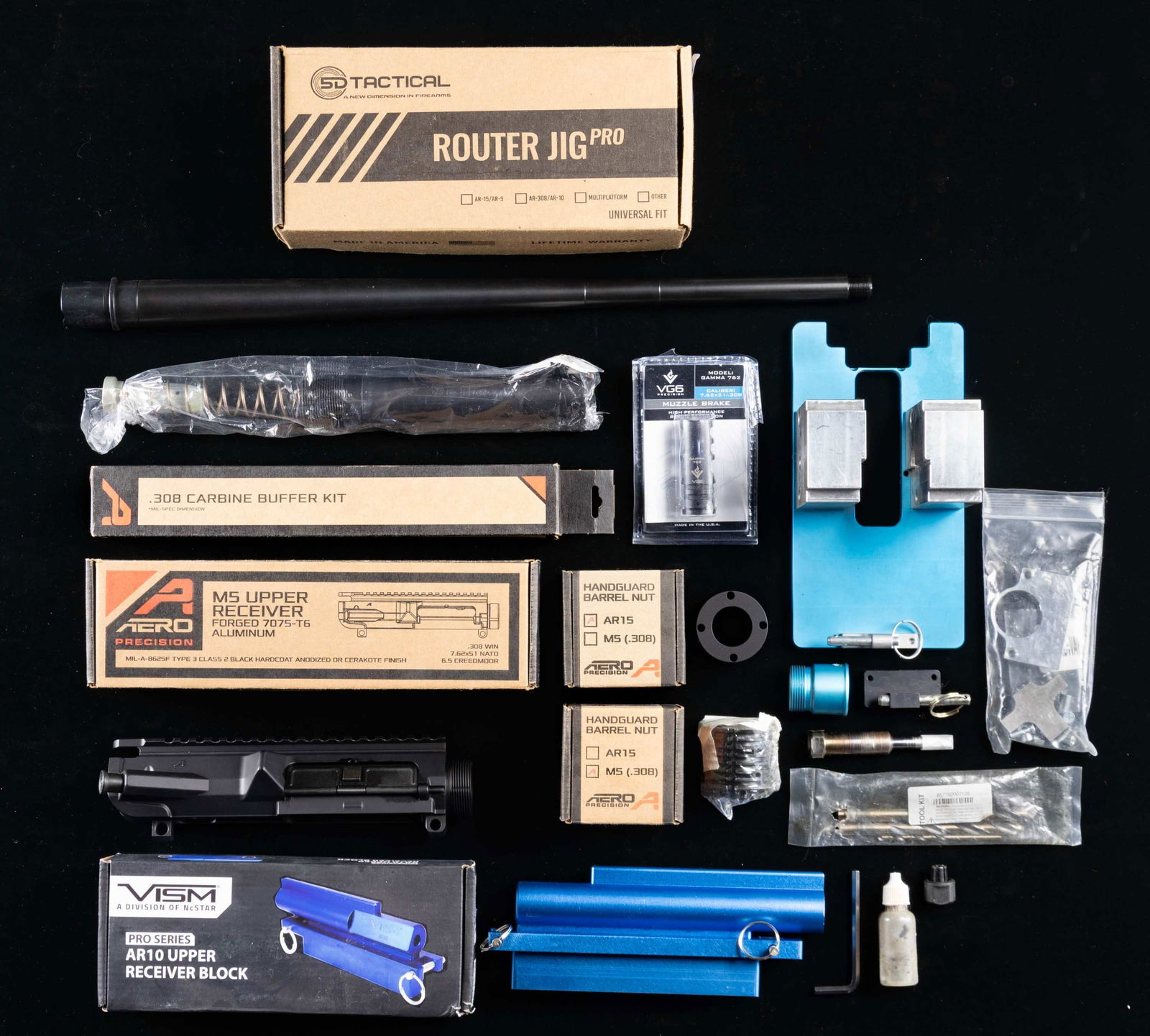 ASSORTMENT OF AR-15 & AR-10 TOOLS & PARTS: Grouping includes the following:1) 02-25526 5D Tactical AR15 Milling Jig Aluminum.2) 02-25527 VISM AR10 Upper Receiver.3) 02-25528 Aero Precision AR15 Handguard & Barrel Nut.4) 02-25529 Aero Precision