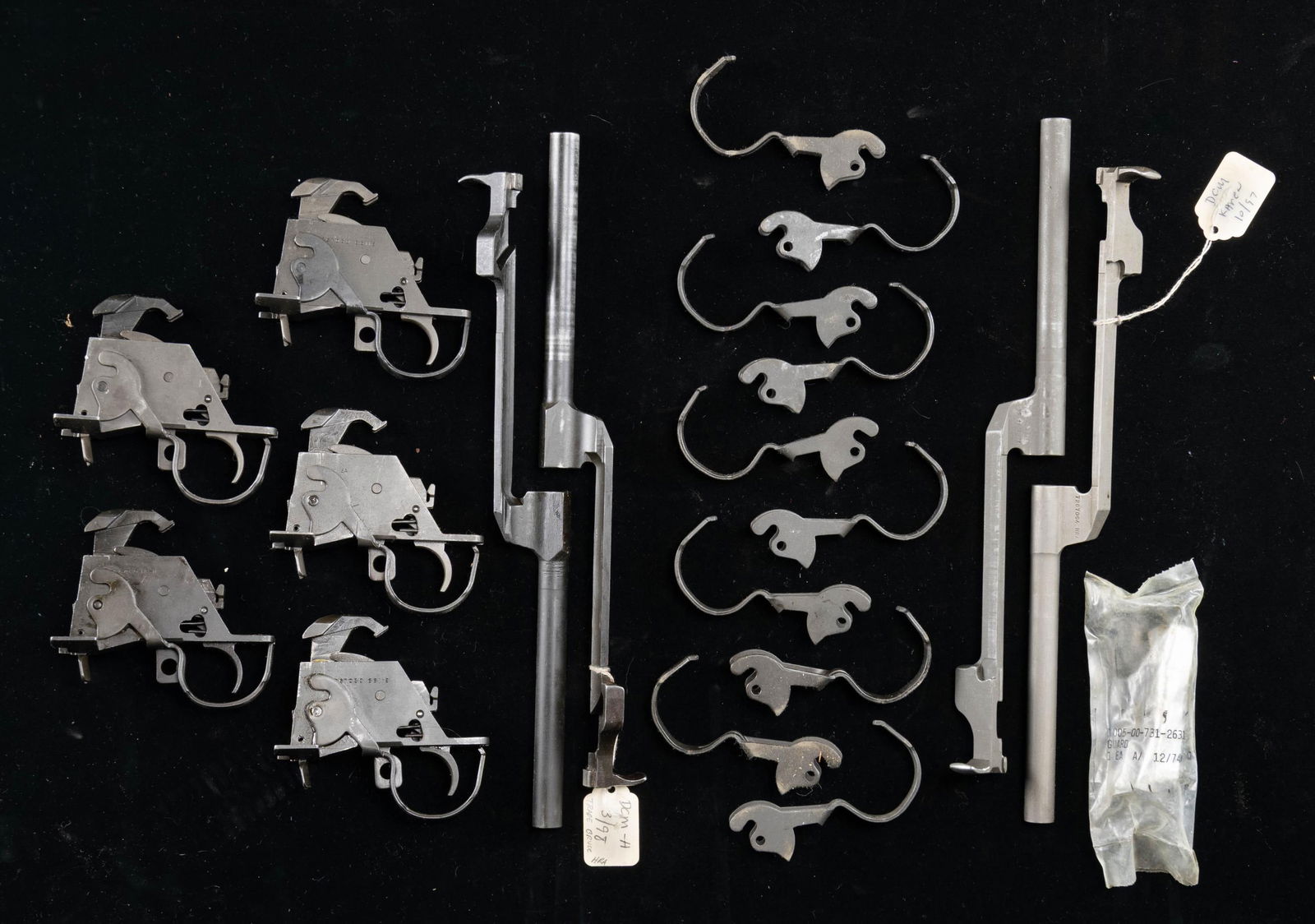 LOT OF USGI M14 PARTS.: This lot consists of the following: 1) Five complete M14 trigger groups. Makers appear to be a mix of Springfield Armory & HRA. 2) Four op rods. One is of TRW mfr, two HRA & one Springfield Armory.