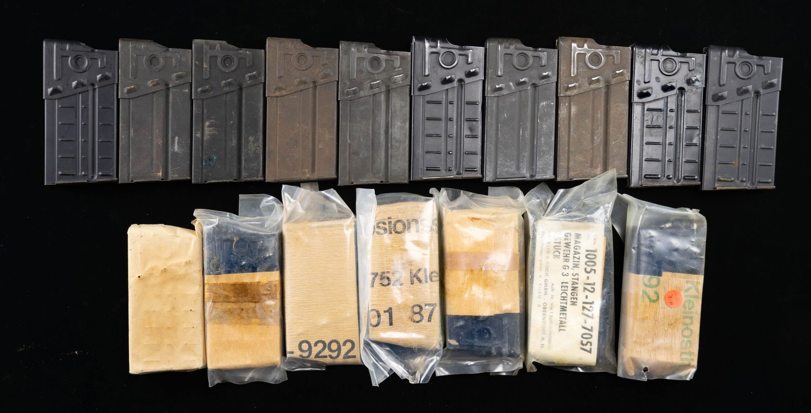 LOT OF 17 ASSORTED G3/HK91 MAGAZINES.: Lot of 17 assorted G3/HK91 mags., including: 1) x4 20-rd. aluminum mags. 2) x6 20-rd. steel mags. 3) x7 20-rd. aluminum mags. (x5 in opened plastic and paper packaging, x1 in paper packaging, and x1