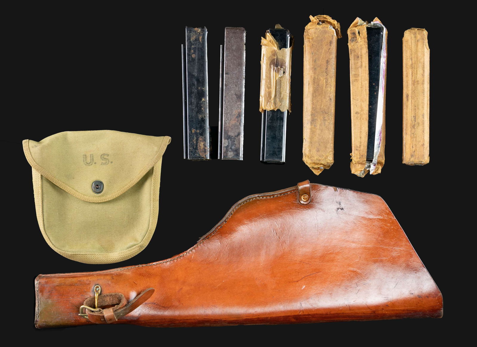 LOT OF THOMPSON STICK MAGAZINES, DRUM CARRIER, &: MOTORCYCLE SCABBARD. Lot consists of: 1) Unmarked (likely) reproduction Thompson submachine gun scabbard, as would have been used on Harley Davidson's WLA motorcycle in service with the U.S. Army
