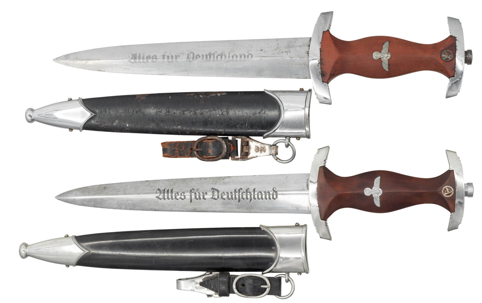 2 WWII GERMAN NSKK DAGGERS.: 1) NSKK dagger measures 14 3/4" overall with a blade that is etched "Alles fur Deutchland" and marked "RZM M7/73" indicating manufacture by F u. A. Helbig of Steinbach. Plated cross guard and pommel