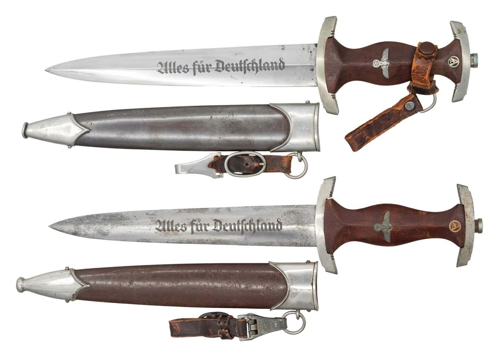2 WWII GERMAN SA DAGGERS.: 1) This SA dagger measures 15" overall with a blade that is etched "Alles fur Deutchland" and marked "RZM M7/42" indicating manufacture by WKC-Waffenfabrik GmbH of Solingen-Wald. Plated cross guard an