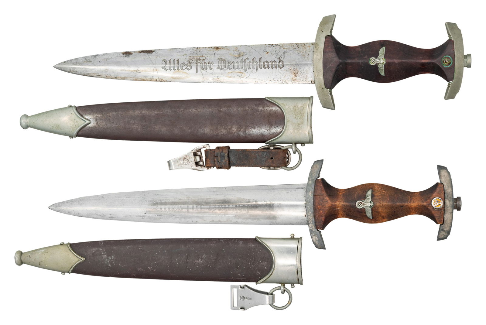 2 WWII GERMAN SA DAGGERS.: 1) WWII German SA dagger measuring 14 7/8" overall with a blade that is etched "Alles fur Deutschland" and is marked "(logo) TIGER SOLINGEN". Nickel silver crossguard stamped "Nrh" for the group distr