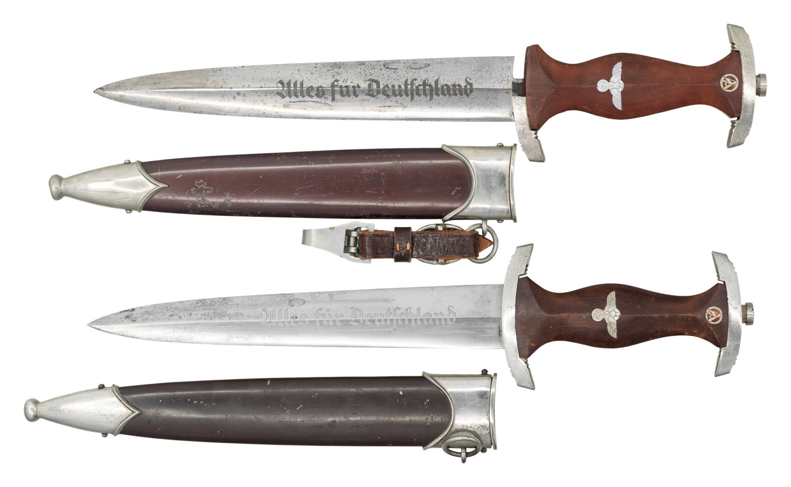 2 WWII GERMAN SA DAGGERS.: WWII German SA dagger measuring 15" overall with a blade that is etched "Alles fur Deutschland" and is marked "RZM M7/85" which indicates manufacture by Arthur Evertz of Solingen. Plated cross guard a