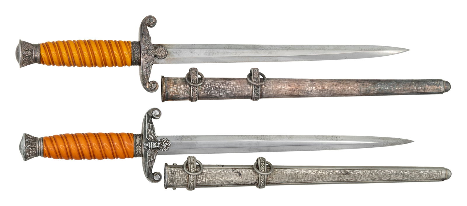 2 WWII GERMAN ARMY DAGGERS.: 1) A nice example of a WWII German Army dagger measuring 15 3/4" overall with a plain blade marked "Siegfried EARNST PACK & SOHNE M.B.H. WAFFENFABRIK (logo) SOLINGEN WAFFEN". Plated eagle crossguard w