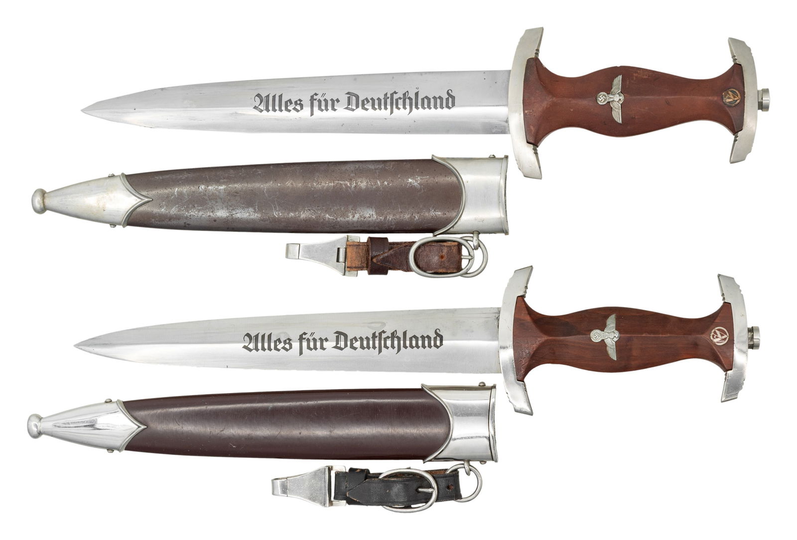 2 WWII GERMAN SA DAGGERS.: 1) WWII German SA dagger measuring 14 3/4" overall with a blade etched " Alles fur Deutschland " and marked " HERM. KONEJUNG A. G. SOLINGEN (logo) ". Nickel silver crossguard stamped " B " on the reve