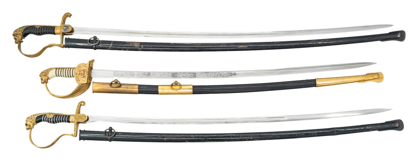 3 WWII GERMAN OFFICER'S SWORDS.: 1) WWII German Army officer's sword measuring 39 1/2" overall with a plain blade marked "(logo) PUMA SOLINGEN". Gilded white metal hilt with reverse P guard and lion head pommel having "ruby" eyes.