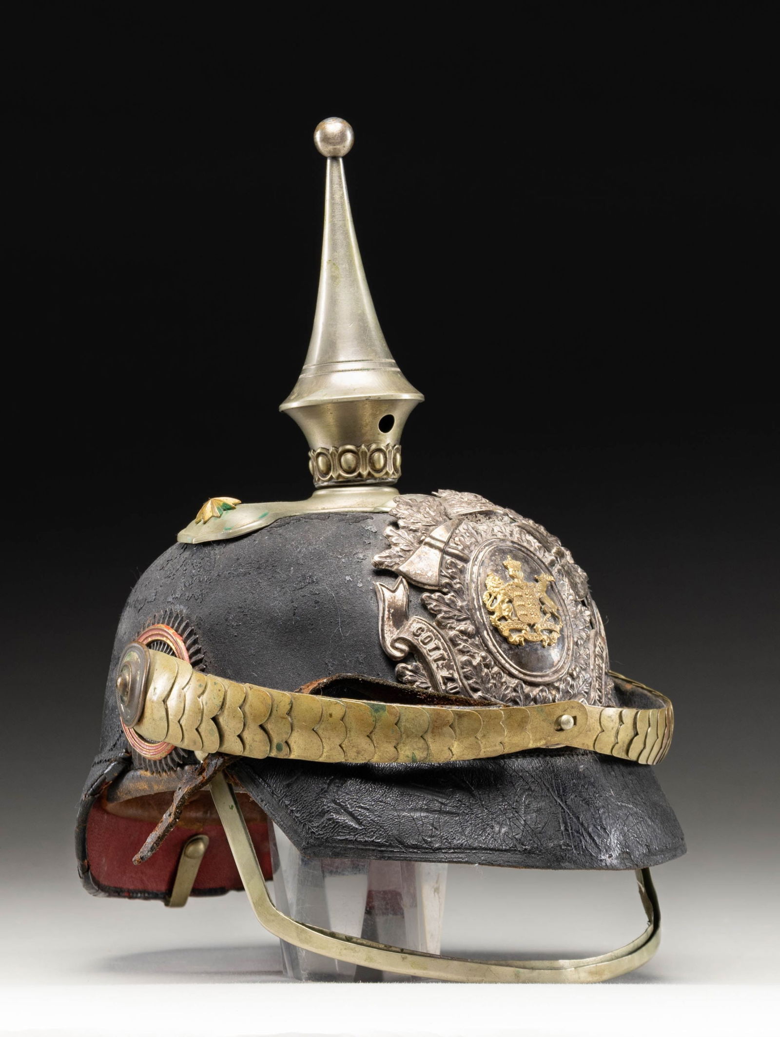 IMPERIAL GERMAN WURTTEMBERG FIRE OFFICIAL'S: SPIKE HELMET. A good imperial German fire official's spike helmet from Wurttemberg. The helmet stands about 10 1/2" in height and measures about 9 " front to back. It shows a slivered ball topped spik