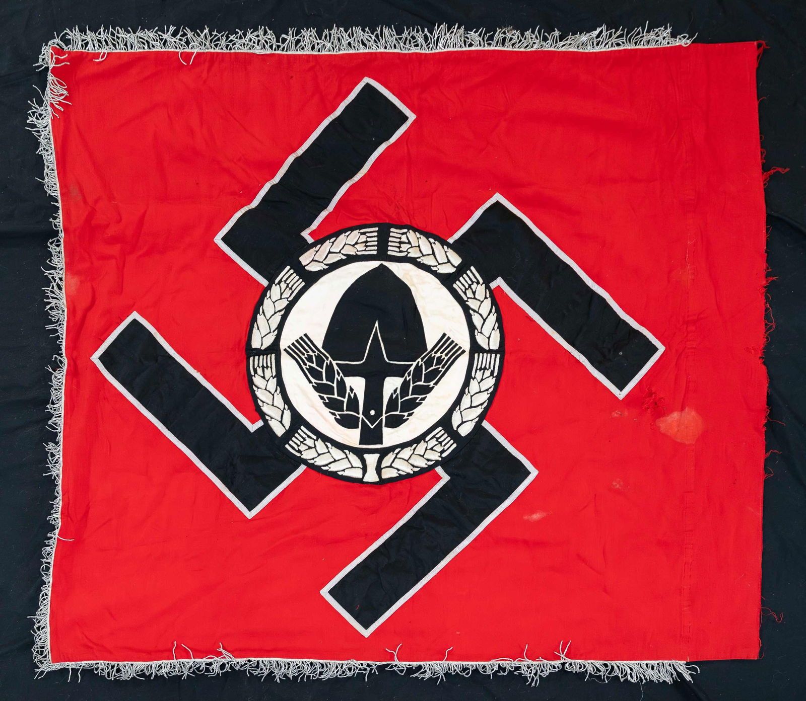 EXCEPTIONAL WWII GERMAN RAD HEADQUARTERS FLAG.: This superb WWII German RAD flag measures approximately 43 1/8" x 50" and is red, white, and black with ample silver bullion trim. 3 sides of the flag are surrounded by 2" silver bullion fringe. The c