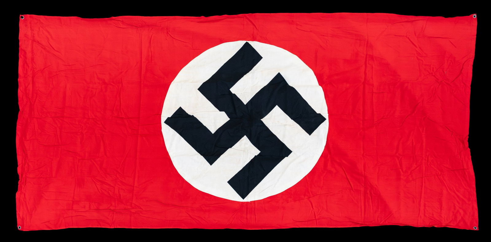 WWII GERMAN PARTY FLAGS.: 1) WWII German party flag measuring 51" x 27". 2) WWII German Party flag measuring 29 1/2" x 45 1/2". 3) WWII German Party flag measuring 29" x 57". WWII German Party banner measuring 79" x 37 1/2". C