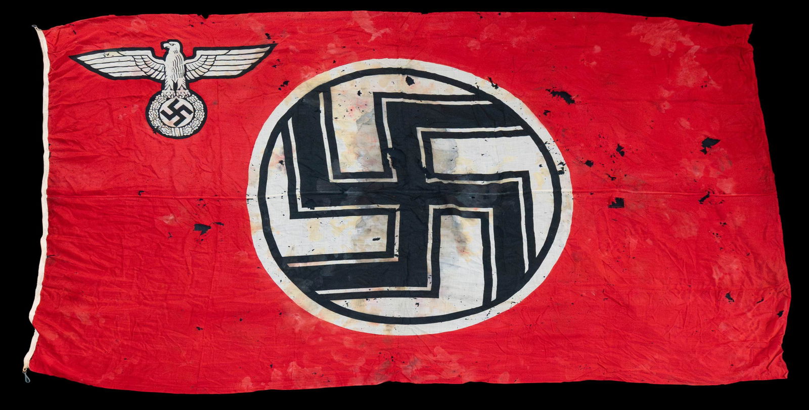 LARGE WWII GERMAN STATE SERVICE FLAG.: A very large printed WWII German state service flag measuring about 154" x 86". The flag is of standard form for a state service flag with an eagle in the canton area and a encircled squared Party sym