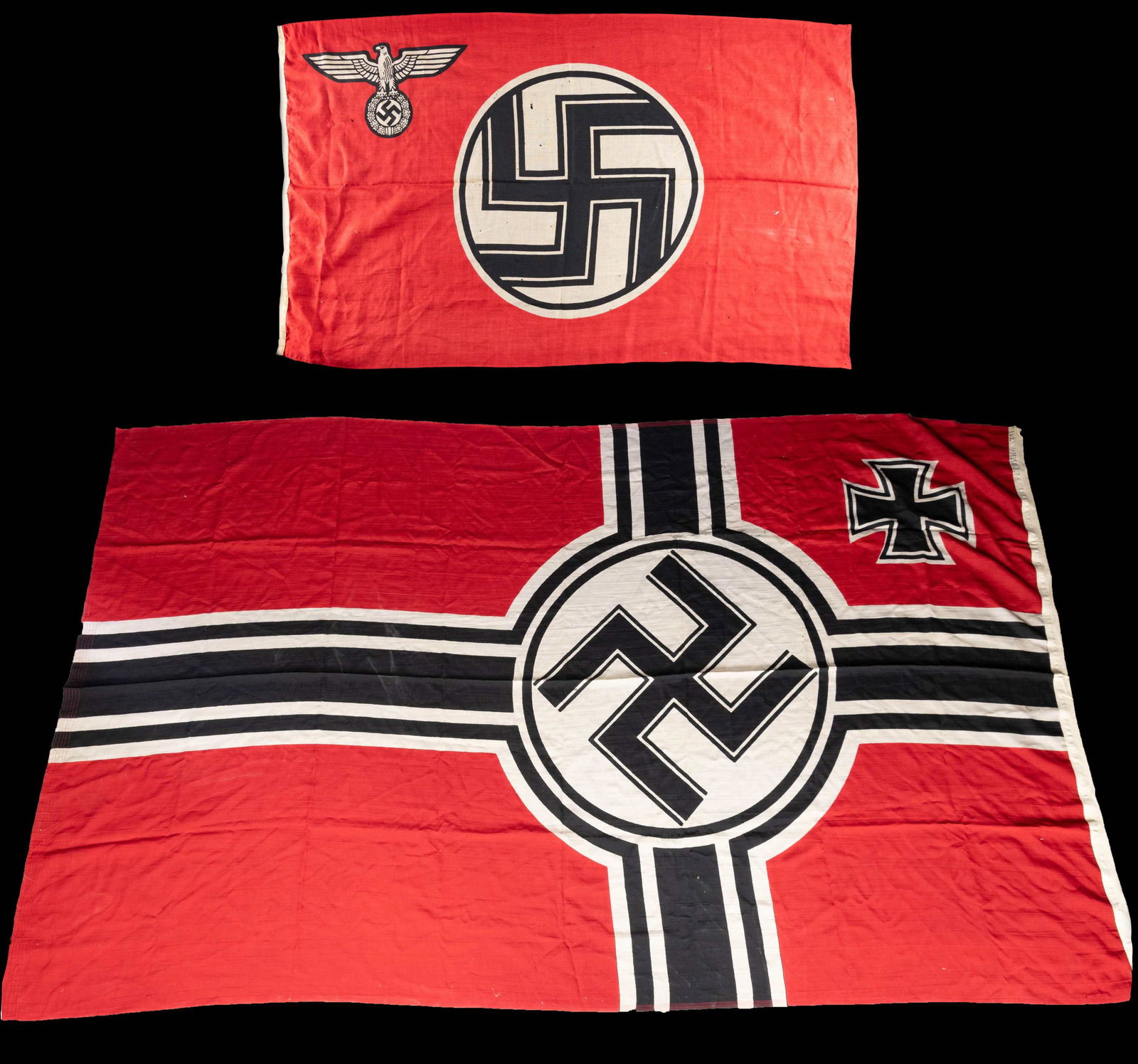 2 WWII GERMAN FLAGS.: 1) A large WWII printed German Kriegsmarine battle flag measuring approximately 80" x 128". The hoist is marked with the eagle over "M" denoting Kriegsmarine use along with "Kr. Fl. 200x335 cm" & " Ko