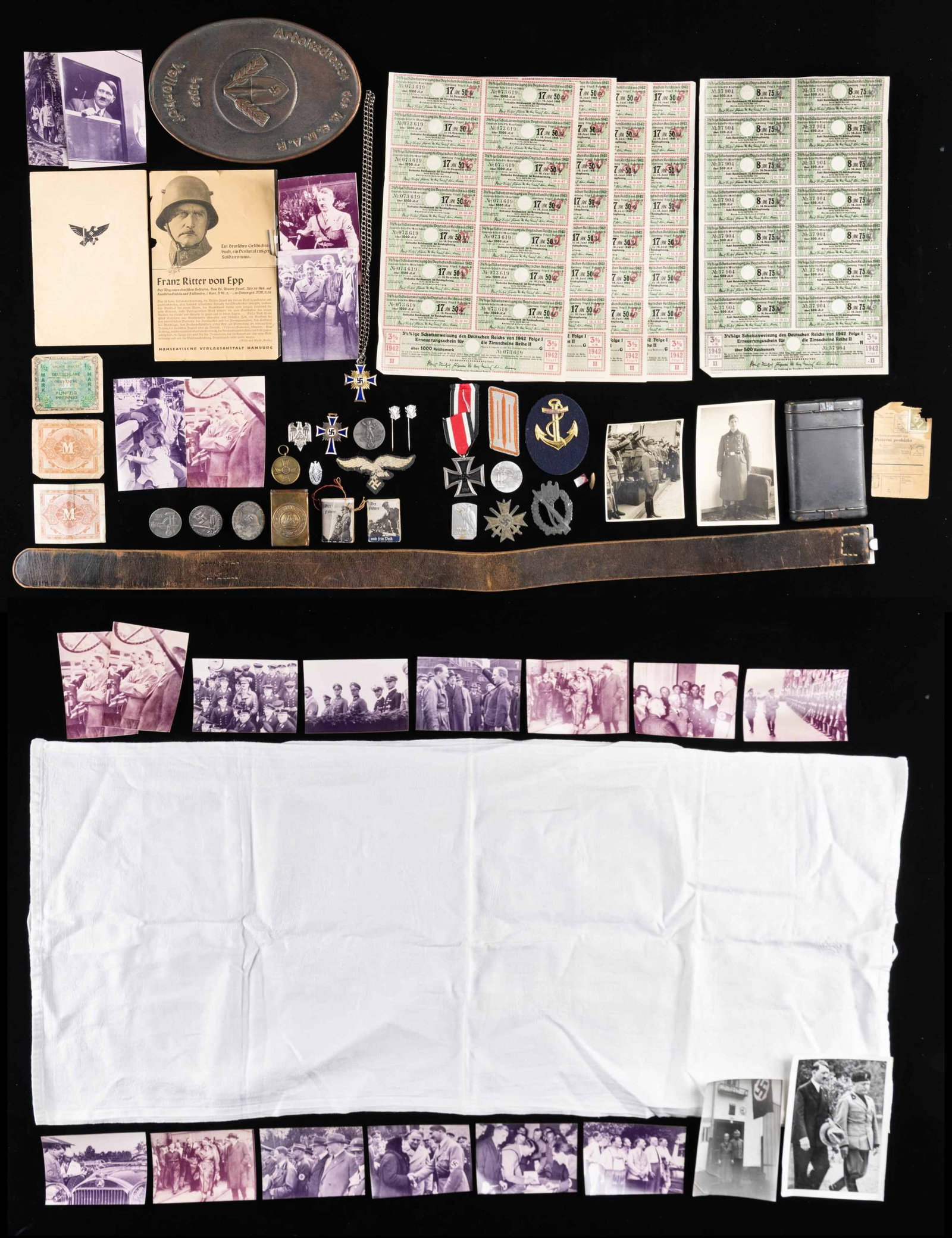 WWII GERMAN MILITARIA AND RELATED ITEMS.: This lot contains 5 WWII German bonds dated 1942 each with14 coupons attached, 3 pieces of occupation currency, 23 German photographs some of which may have been printed after the war, 5 pieces of WWI