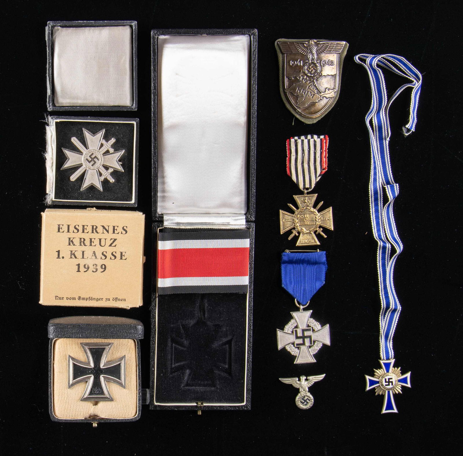 WWI & WWII GERMAN MEDALS, BADGES, AND MORE.: This fine lot of WWII German awards includes 1 Gold Mother's cross with ribbon, 1 Krim shield with backing, 1 Faithful Service Cross for 25 years with ribbon, 1 War Merit Cross 1st Class with Swords i