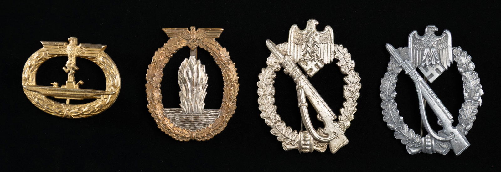 4 WWII AND WWII STYLE GERMAN BADGES.: This lot includes 1 Minesweeper Badge of original WWII manufacture with a wide pin on the reverse and a cast in catch, 1 Submarine War badge of questionable age with a narrow pin on the reverse and an