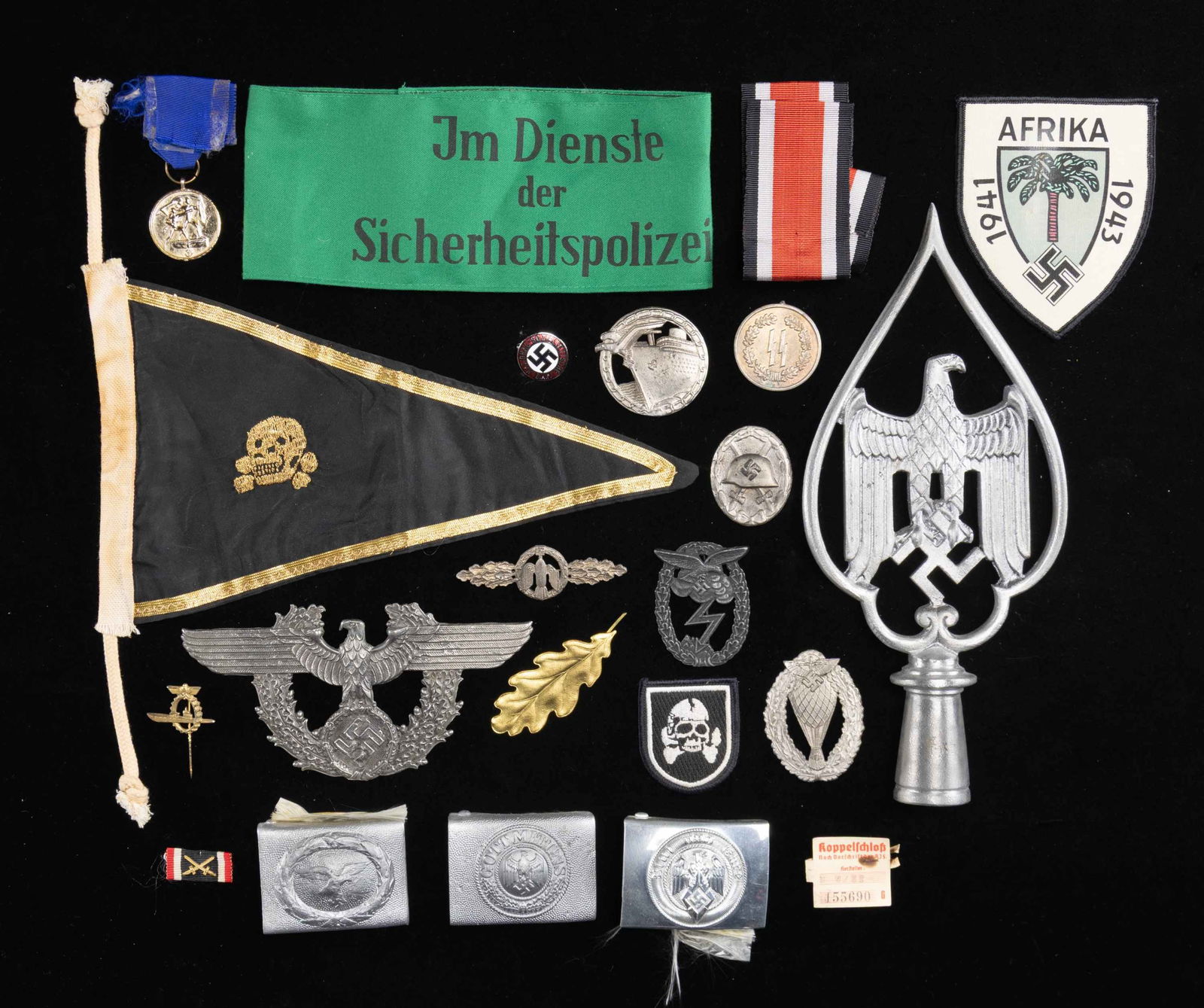 WWII STYLE GERMAN BUCKLES, BADGES, AND MORE.: this lot of reproduction WWII German items include, 1 army belt buckle, 1 HJ belt buckle, 1 luftwaffe belt buckle, 1 Party pin, 1 aluminum veteran's flag pole top, 1 Silver Wound badge with no pin, 1