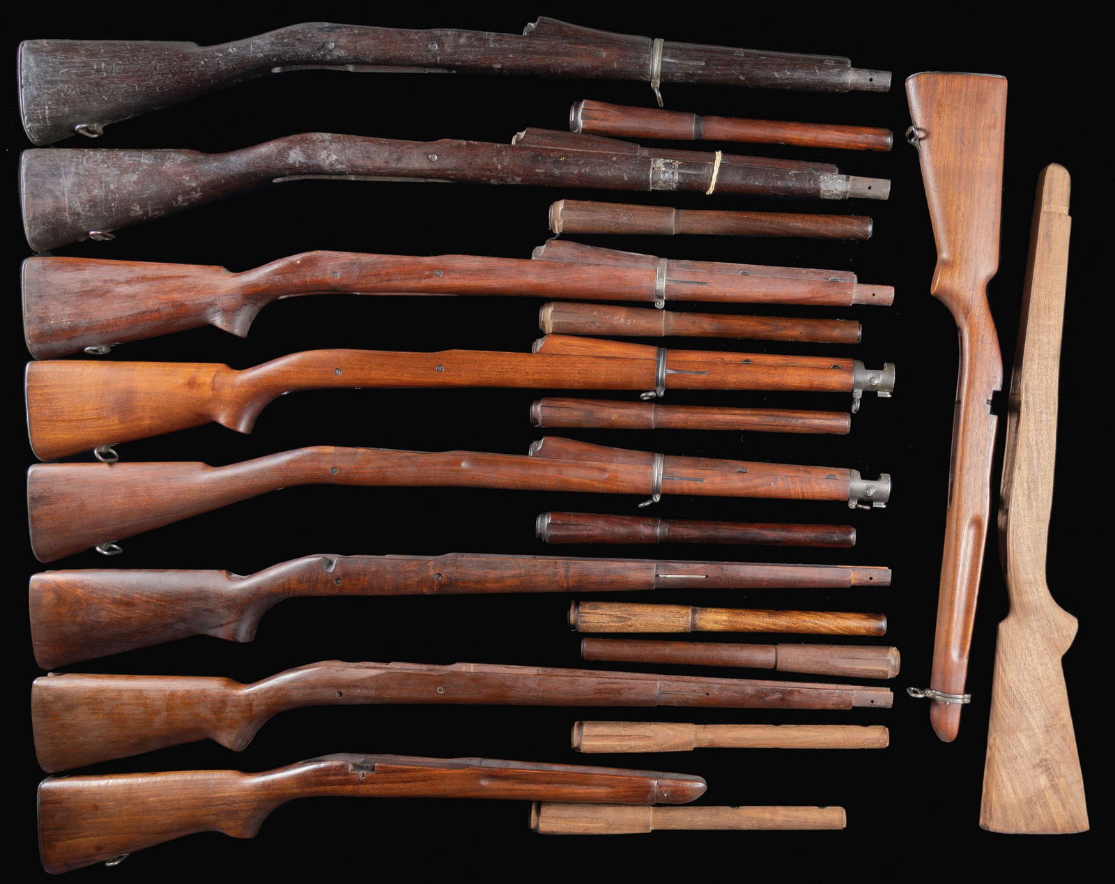 VERY DESIRABLE GROUPING OF STOCKS AND HANDGUARDS: FOR MODEL 1903, MODEL 1903A3 AND 22 CALIBER TRAINING RIFLES. 1) Model 1903 S Type Straight Grip Walnut Stock w/ High Hump Handguard. Stock w/ single recoil bolt marked on left side w/ boxed "JFC" & ma