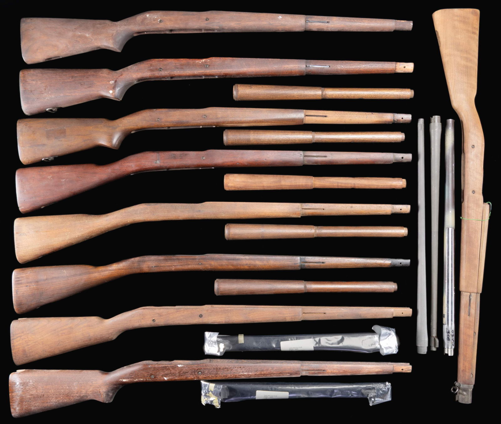 GROUPING OF 19 US MODEL 1903A3 STOCKS, BARRELS AND: HANDGUARDS. (Barrels). No.1: 30-06. US Remington. Marked behind front sight "RA / flaming bomb / 2-44". 24" barrel is fitted w/ front sight base. CONDITION: barrel retains all of its original parkeriz
