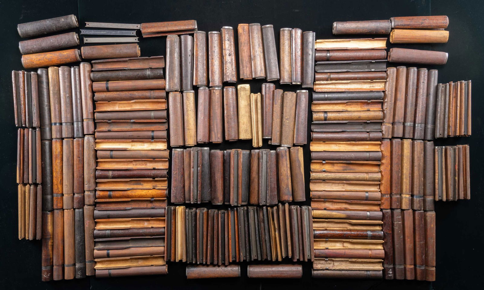 GROUPING OF 72 FRONT AND 76 REAR M1 GARAND: MILITARY RIFLE HANDGUARDS. The handguards are a mix of US & foreign manufacture. Many are walnut. These handguards appear to be removed from rifles which had seen long hard service in harsh environmen