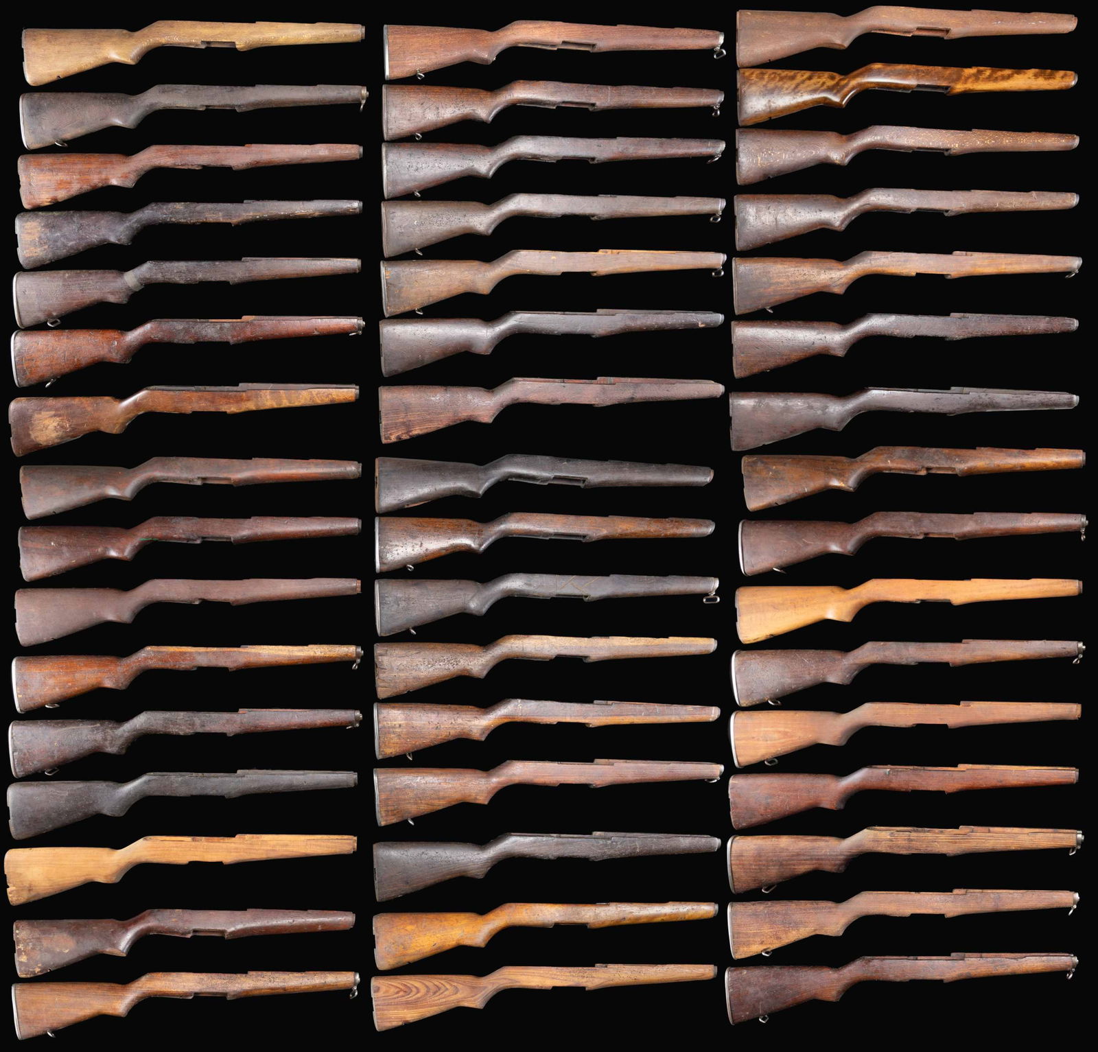 GROUPING OF 48 M1 GARAND RIFLE BUTTSTOCKS.: These buttstocks appear to have been removed from imported rifles & have seen extensive hard service. Many if not most of the stocks are of unknown hardwood & are of indeterminate origin. Stocks may r