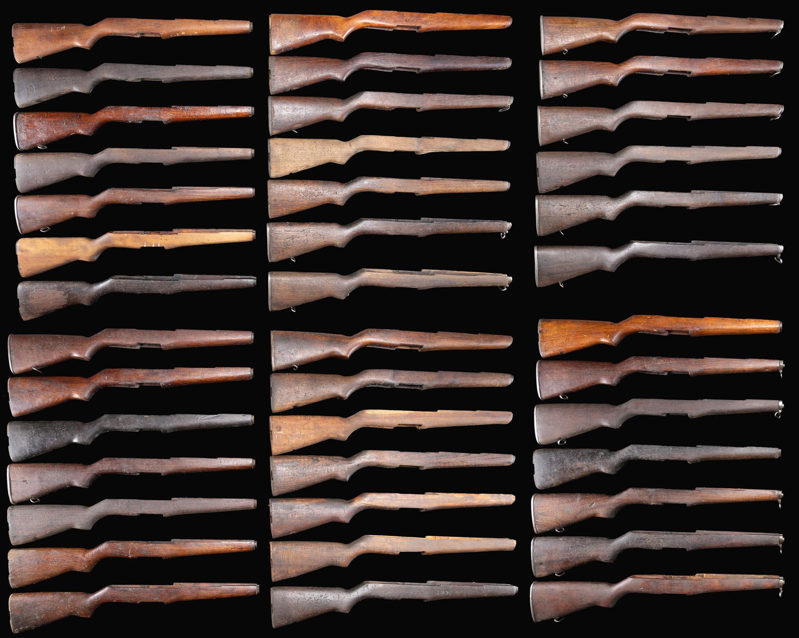 GROUPING OF 41 M1 GARAND RIFLE BUTTSTOCKS.: These buttstocks appear to have been removed from imported rifles & have seen extensive hard service. Many if not most of the stocks are of unknown hardwood & are of indeterminate origin. Stocks may r