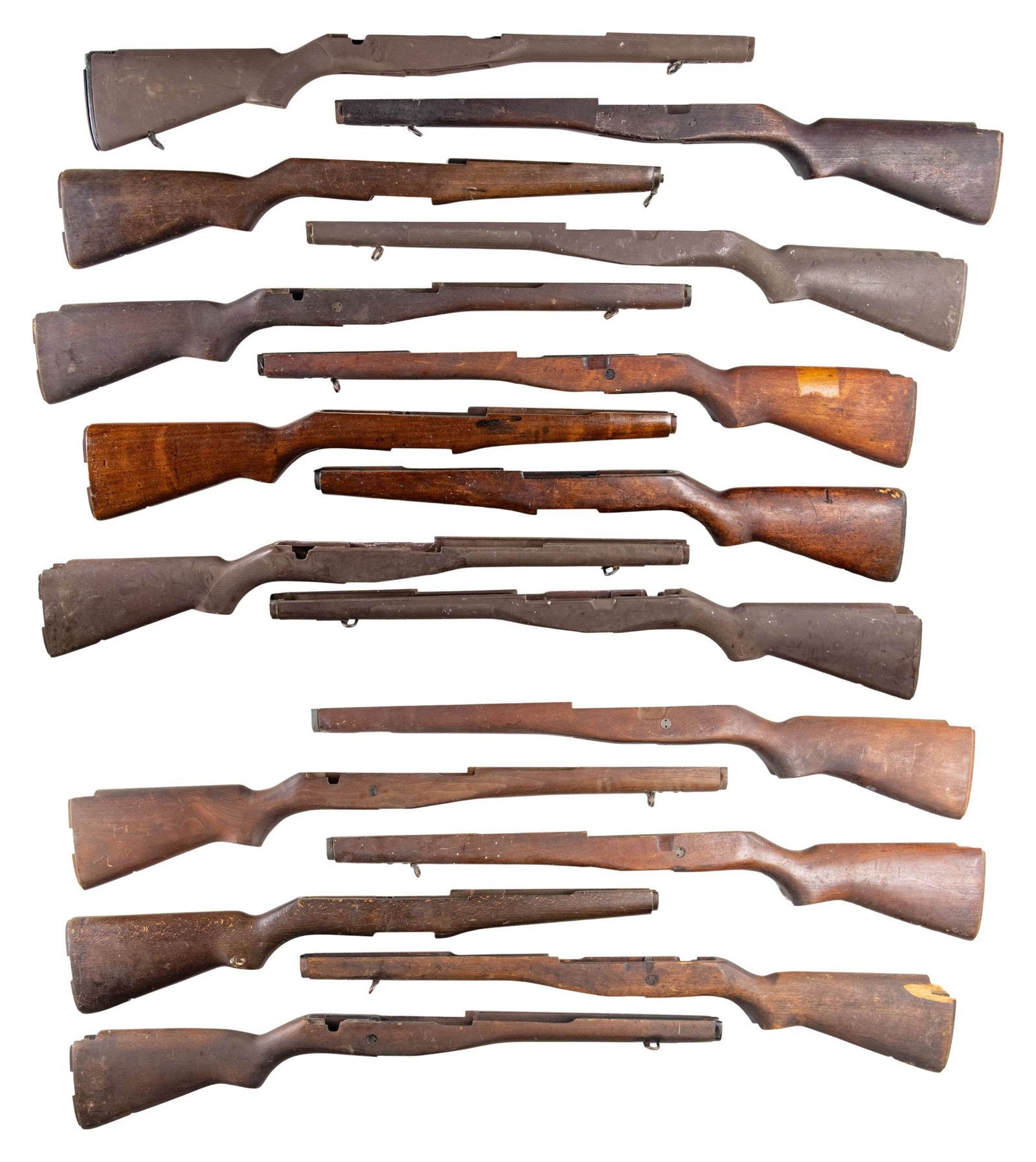 GROUPING OF 16 M14, M1A AND M1 GARAND STOCKS.: 1) Four brown synthetic GI issue M14 stocks. Stocks have the later production "checkering". Stocks may be equipped with sling swivels, one has the original buttplate assembly. CONDITION: stocks have l