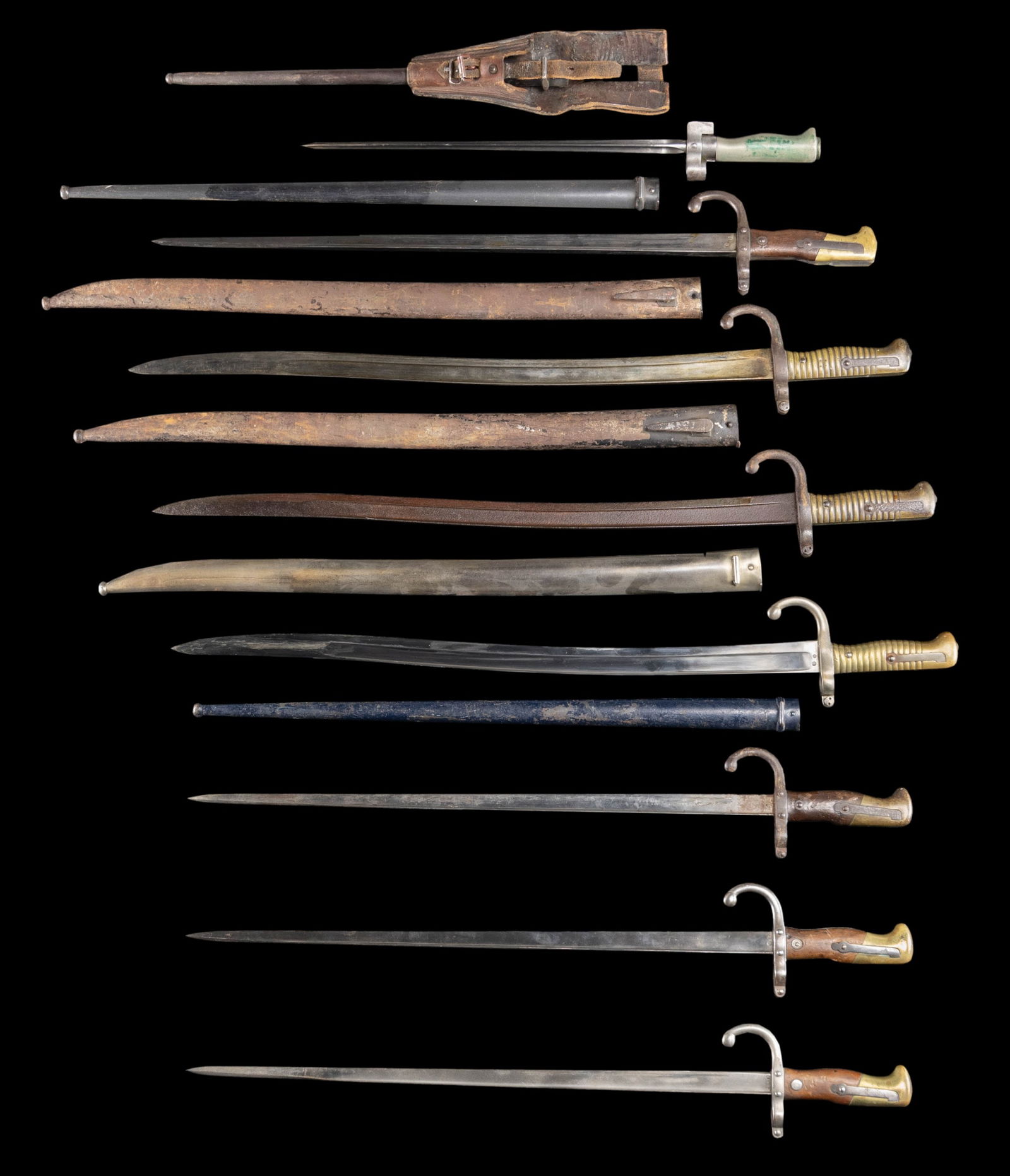 LOT OF 8 FRENCH BAYONETS.: This lot consists of the following: 1) French 1874 Gras Bayonet. No scabbard present. Blade has St. Etienne markings. CONDITION: blade appears lightly cleaned to bright with scattered oxidation. Cross