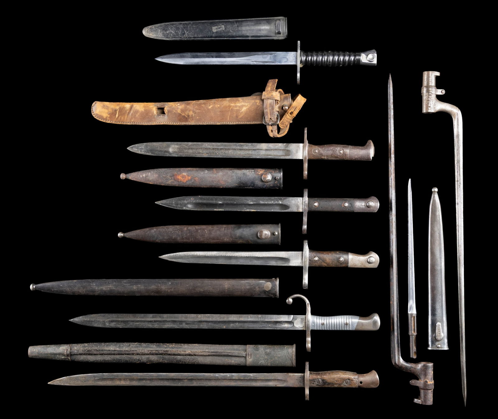 ASSORTED LOT OF 9 BAYONETS.: This lot consists of the following: 1) Swiss PE57 Bayonet. Scabbard present. CONDITION: very good. 2) Argentine 1891 Bayonet. Weysberg made bayonet with ground crest. Scabbard present that is mismatch