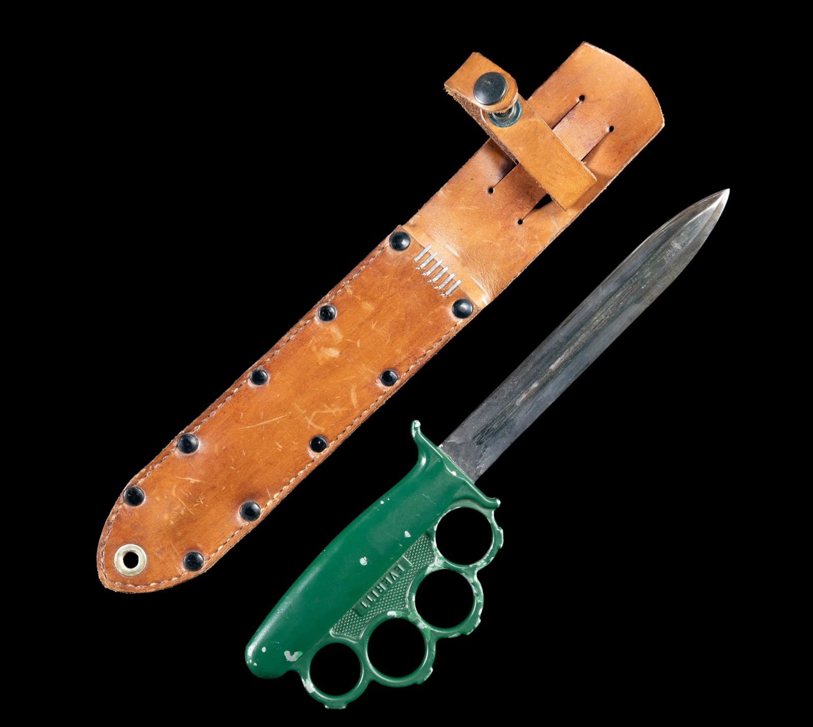 VERY FINE, WWII PACIFIC THEATER EVERITT KNIFE: & SHEATH. Dbl. edged 7" with single fuller & black finish; overall: 12". Dark green painted alloy handle with four knuckles. Tan leather sheath with snap closed retaining strap, correct 6 staples at t