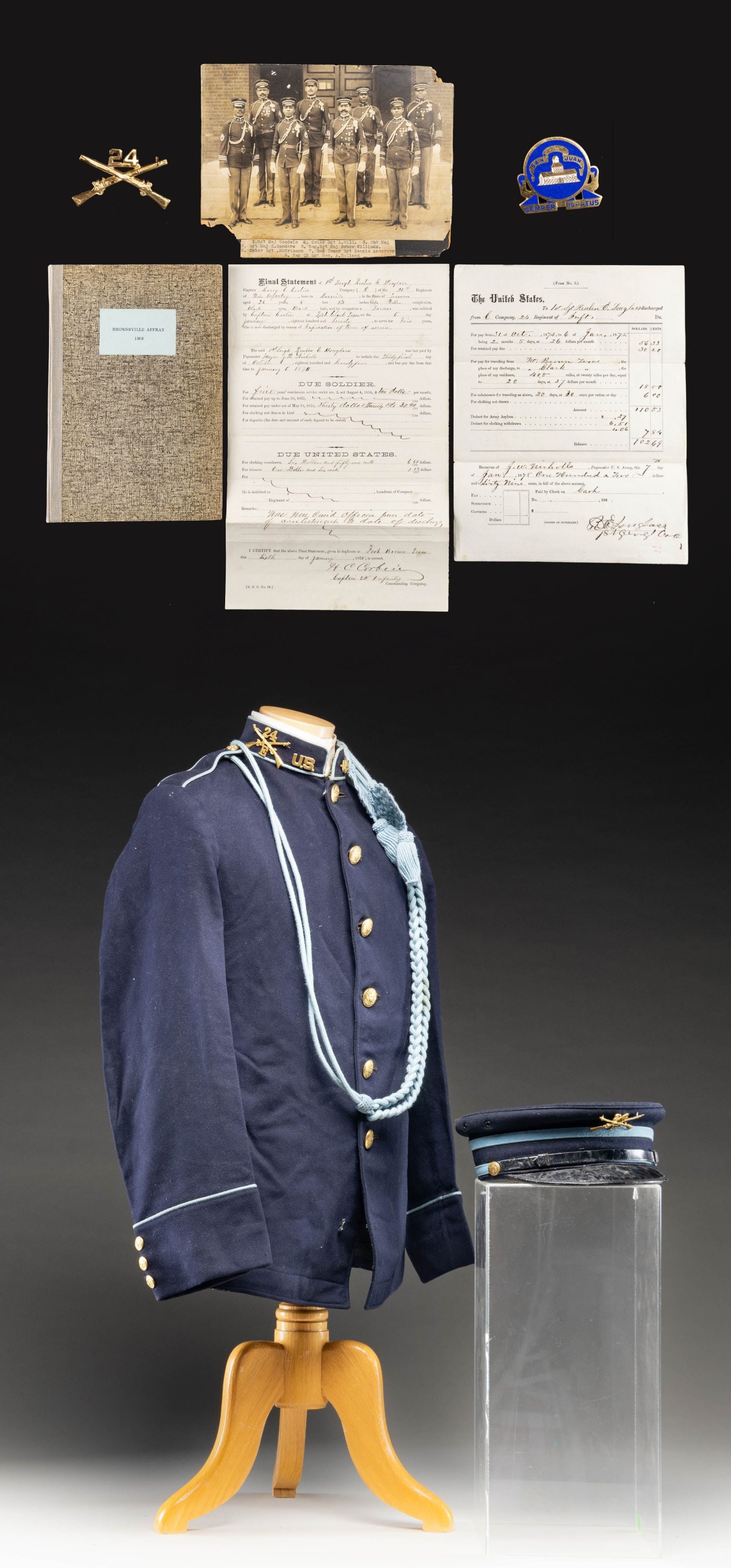 AFRICAN-AMERICAN 24th INFANTRY BUFFALO SOLDIER: UNIFORM & EPHEMERA. 1902 style 6-button frock coat & visor cap both with 24th Infantry insignia, 9"x6" photograph of 8 identified NCOs of the 24th in uniform, 24th Inf discharge certificate of 1st Sgt