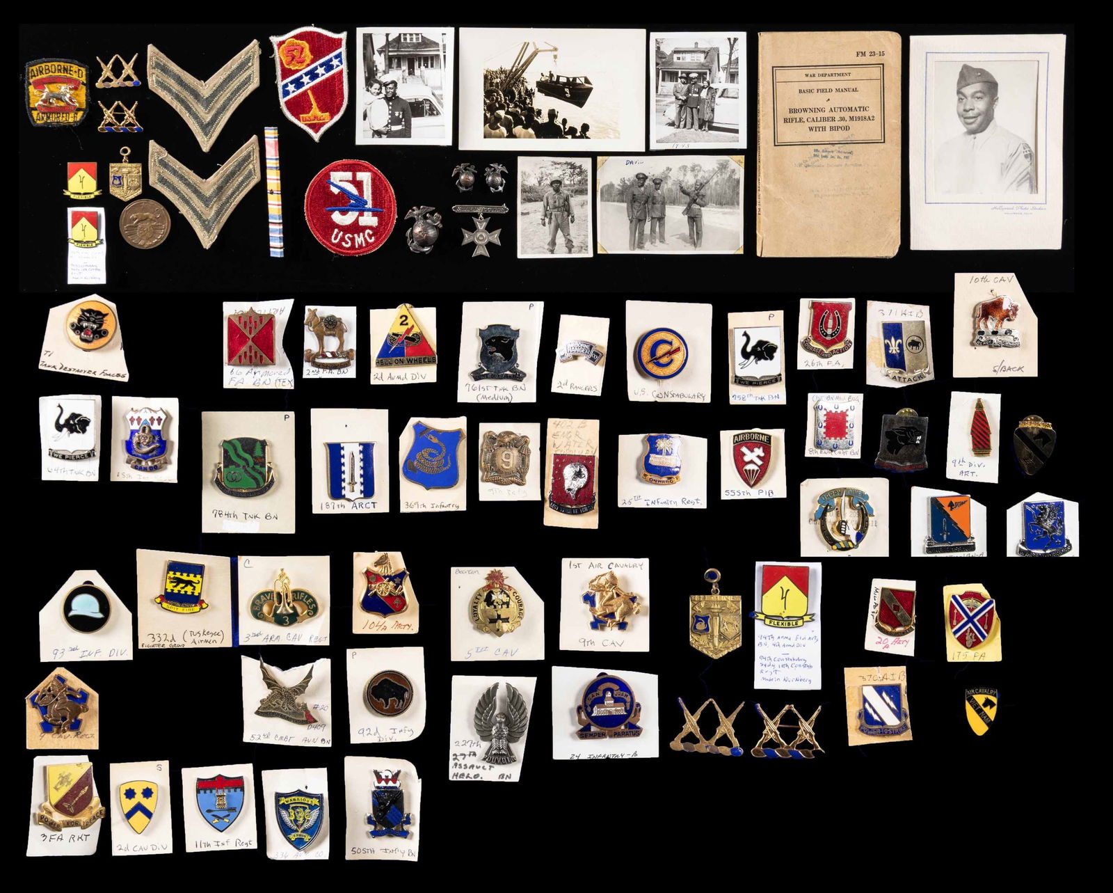 AFRICAN-AMERICAN MILITARY INSIGNIA & EPHEMERA.: Collection of 50 WW2 African-American distinctive unit insignia, many rare and hard to locate examples, rare WW1 371st Infantry medal and 369th Infantry sports award-1927. Flat of black marine photos,