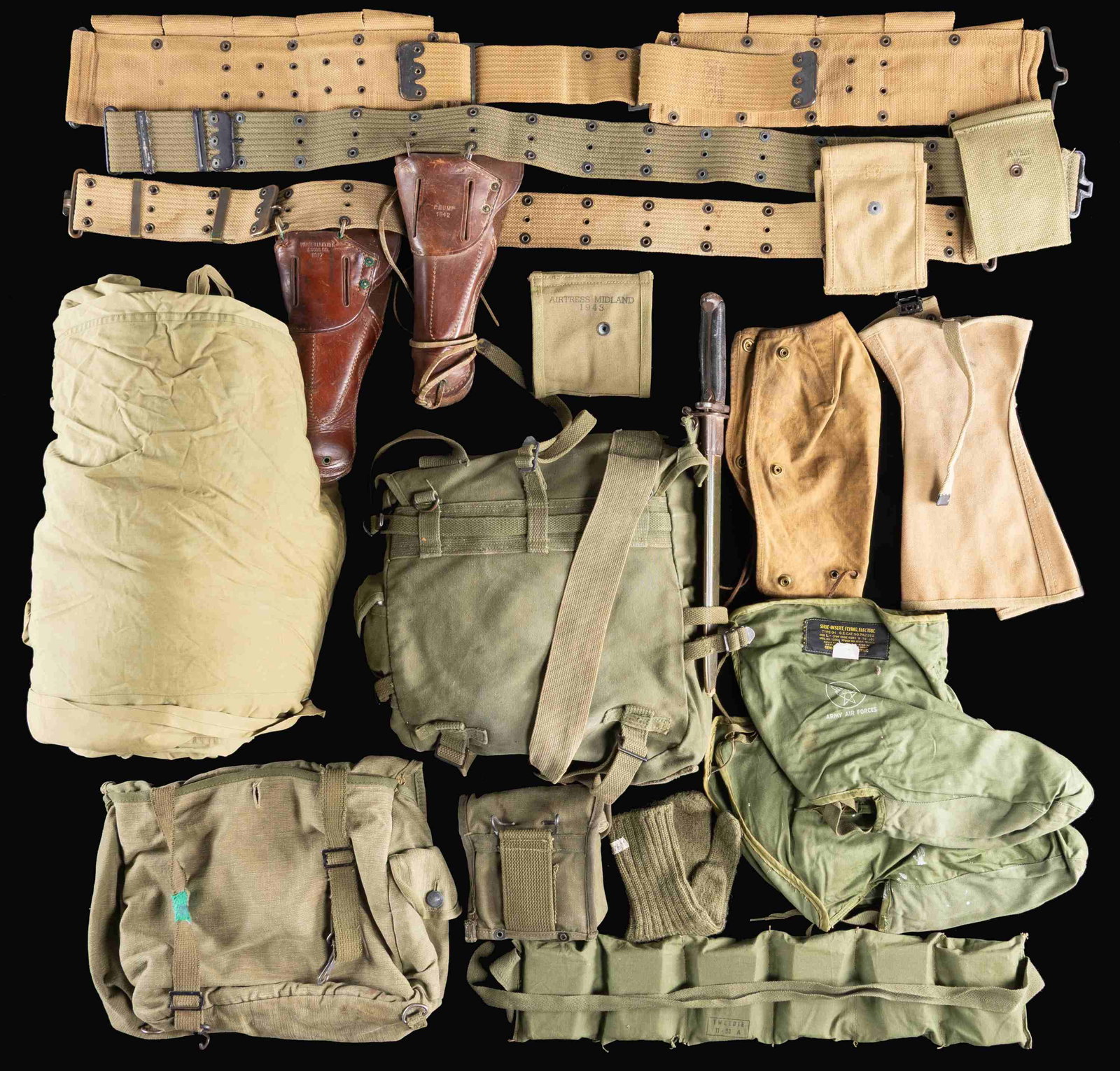 US MILITARY FIELD GEAR AND EQUIPMENT.: This group consists of 1 / WWII GI sleeping bag. 1 / Dual 30cal carbine clip pouch with clips. 1 / WWII OD backpack with an attached M1 bayonet & scabbard. 1 / Pair of Army Air Forces electric boot li
