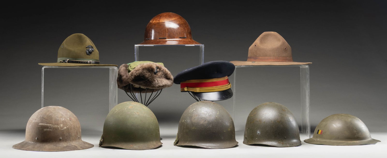 MIXED LOT OF MOSTLY US HEAD GEAR.: This lot consists of the following items: 1) USMC Bauer Down Winter Hat. Small size with USMC emblem on front flap. 2) Top Rank Army Cap. No rank insignia present. 3) USMC DI Hat. USMC emblem on