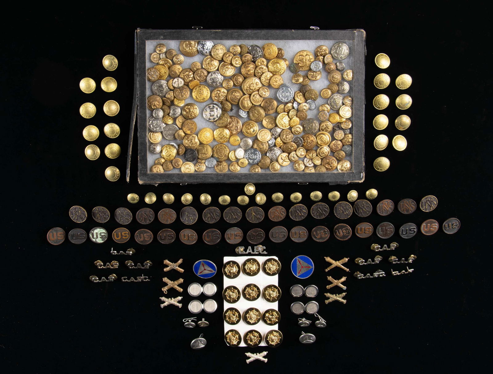 GROUPING OF VINTAGE MILITARY AND CIVILIAN BUTTONS: AND INSIGNIAS. Group includes: 1) 16 U.S. WWI National Army shoulder insignia. The bronze screw-back insignias are without the retainer and most have flaking worn finish. 2) 19 WWI "U.S." well-worn sc