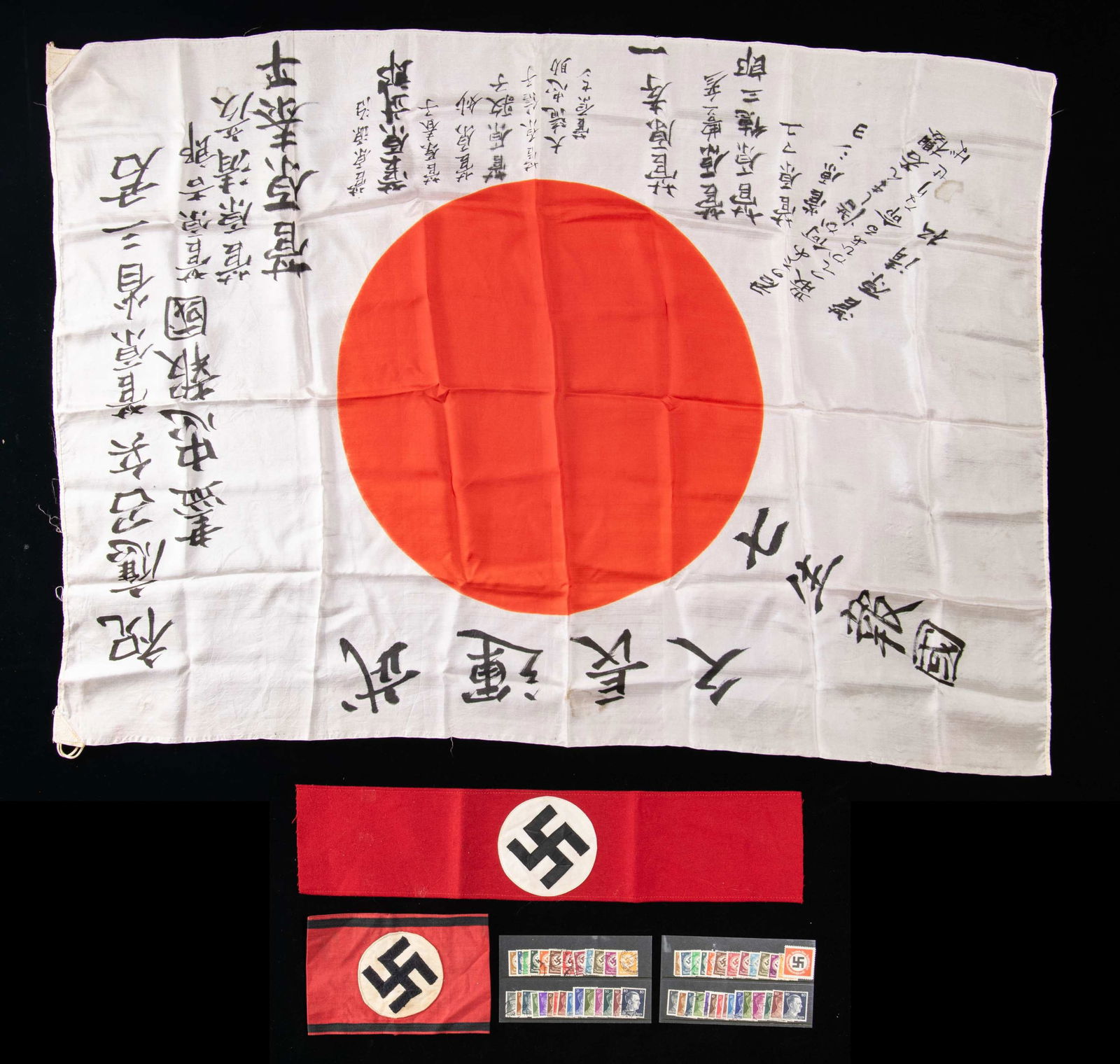 WWII GERMAN AND JAPANESE ITEMS.: This group of axis militaria includes a WWII German Party armband with RZM tag, a WWII German SS cotton armband that may be of post war manufacture but shows age, 28 WWII German letter and document st