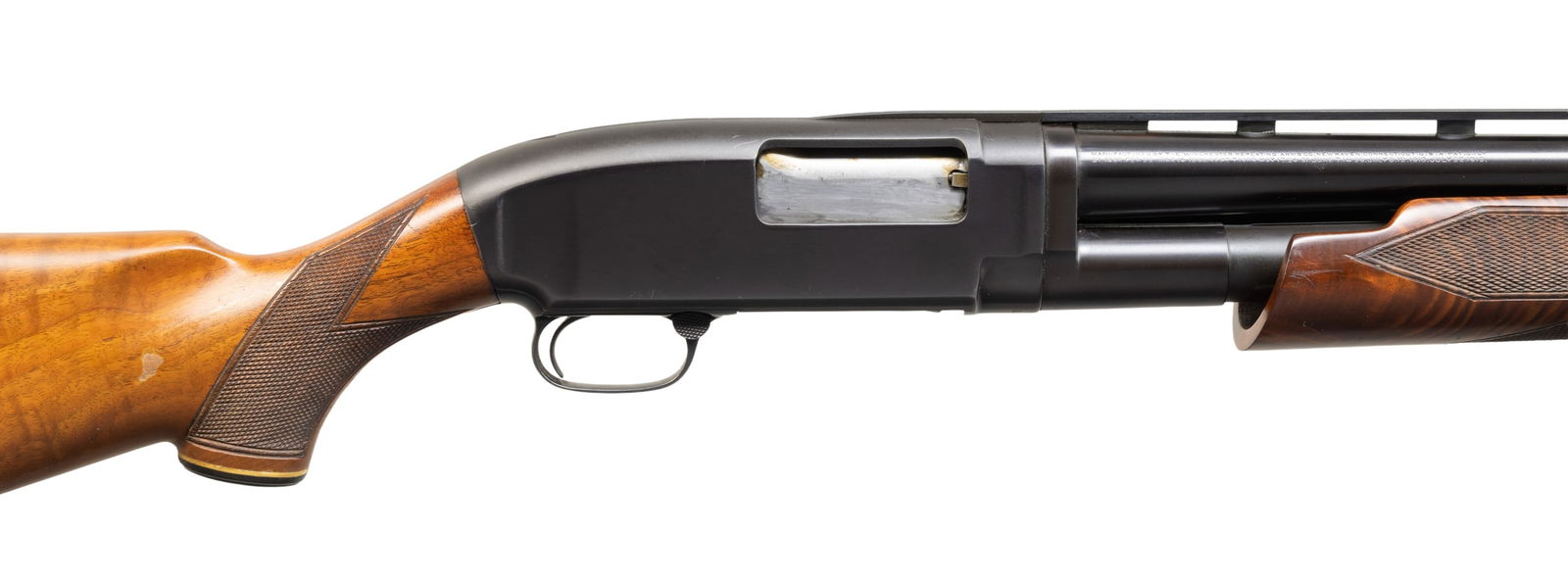 CUSTOM WINCHESTER MODEL 1912 PUMP ACTION SHOTGUN: IN TRAP CONFIGURATION. Cal. 12 GA. S# 184358. Bbl. 31 3/8". Model 1912 pump action shotgun mfg. by Winchester in 1919. Left side of the bbl. exhibits standard factory markings denoting the model and