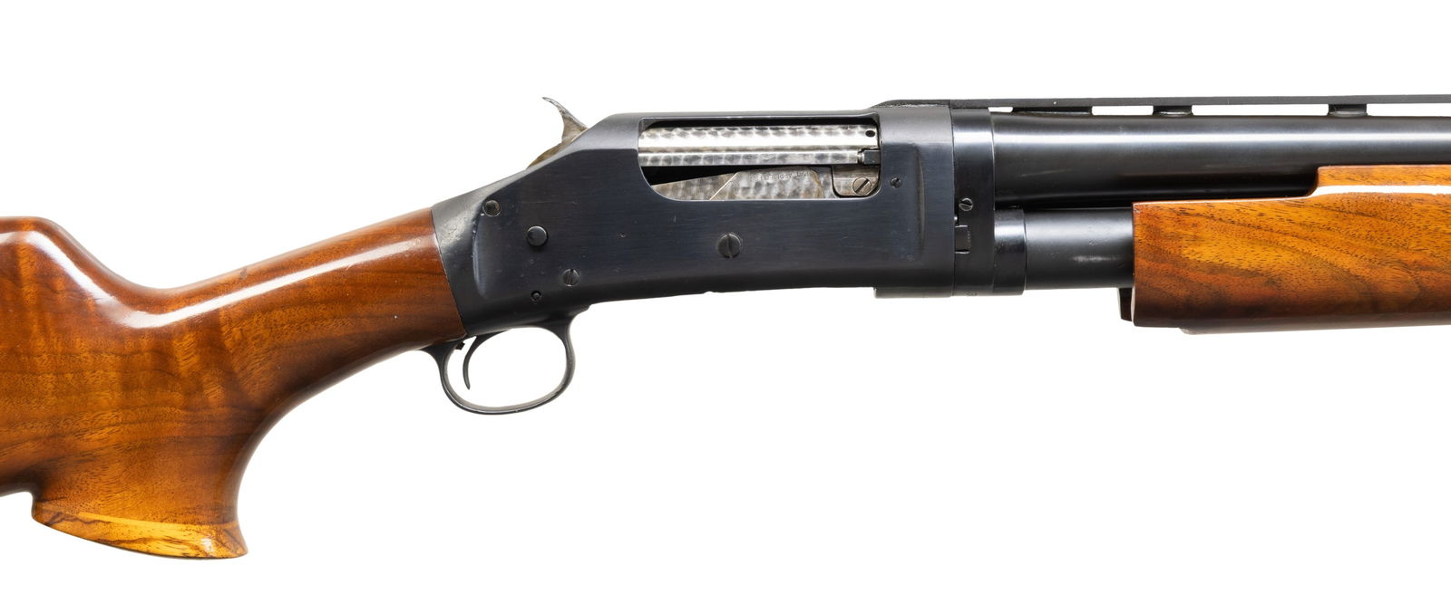 CUSTOM WINCHESTER MODEL 1897 PUMP ACTION SHOTGUN.: Cal. 12 GA. S# 387059. Bbl. 28". Model 1897 pump action shotgun mfg. by Winchester in 1908 and later customized into a custom trap configuration. Bbl. markings have been scrubbed. Side of pump slide