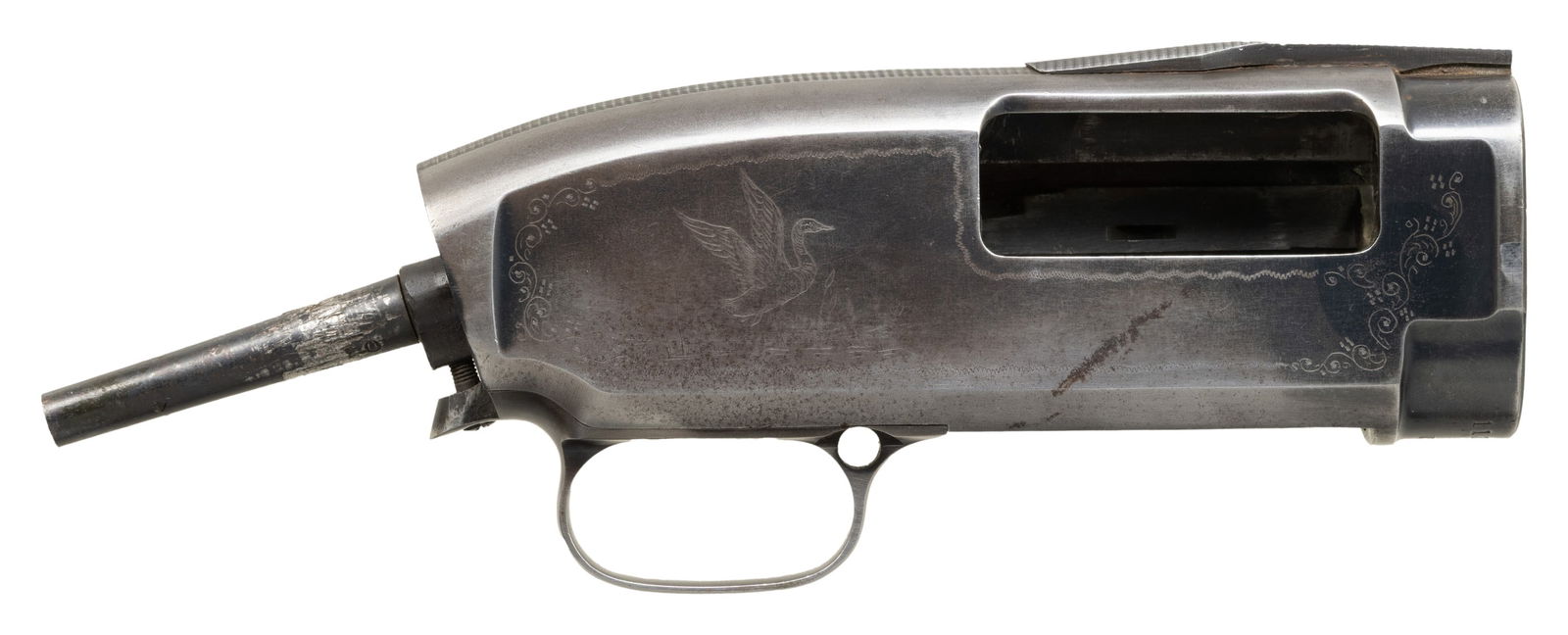 CUSTOM ENGRAVED WINCHESTER MODEL 12 TRAP: 12 GA. STRIPPED SHOTGUN RECEIVER. Cal. N/A. S# 1130871. Bbl. N/A. Model 12 Trap shotgun receiver mfg. by Winchester in 1916. Underside of the receiver is marked with the S# above "TRAP", with "PE"