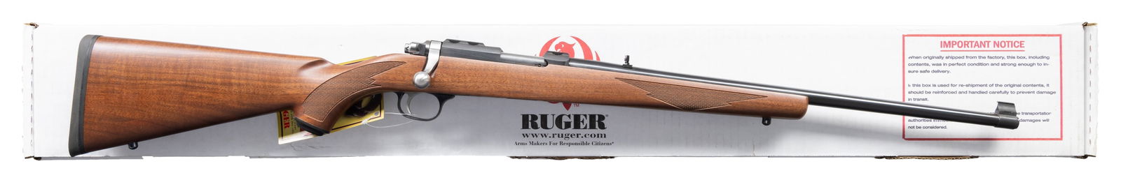 RUGER 22 MAG. MODEL 77/22 BOLT ACTION RIFLE.: Cal. 22 Mag. S# 703-57505. Bbl. 20" with banded brass bead front sight and folding leaf rear. Mfg. 2009 as Model 07017 being blued with checkered walnut stock having grip cap, black rubber pad and