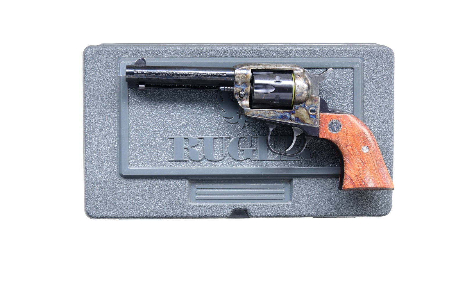 RUGER NEW MODEL SINGLE SIX SA REVOLVER WITH: MATCHING BOX. Cal. 32 H&R MAG. S# 650-43683. Mfg. 2003 as Model 06515 / Catalog No. SSM-4F-S. This Ruger New Model Single Six features a blued and case-hardened finish with a 4.75-inch barrel and fixe